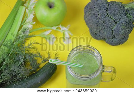 Detox Healthy Green Smoothie In Mason Jar With Ingredients: Spinach, Celery, Cucumber, Lettuce, Ging