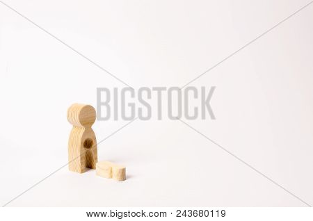 A Wooden Figure Of A Woman With A Void From Which A Child Fell. The Concept Of The Loss Of A Child, 