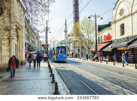 Istanbul, Turkey: Blue Modern Tram On The Historical Street Moving From The Cemberlitas Station On A