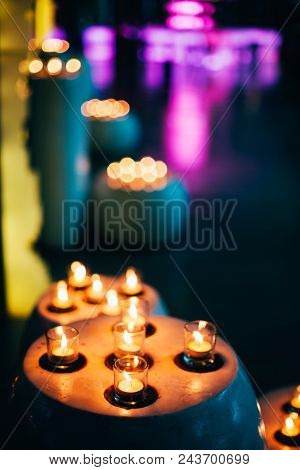 Candles In Spa Zone With Beautiful Relaxing Liight And Dlurry Colorful Backdrop.
