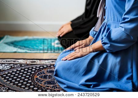 Muslim prayers in Tashahhud posture