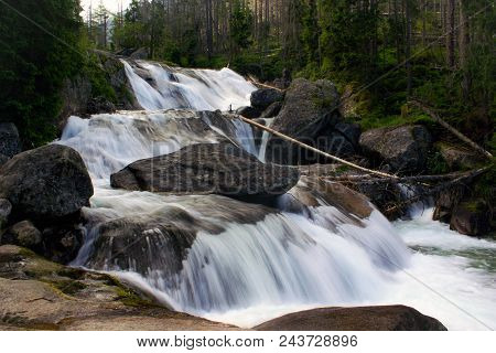 Cascading Waterfall In The Mountains Of The High Tatras In Slovakia