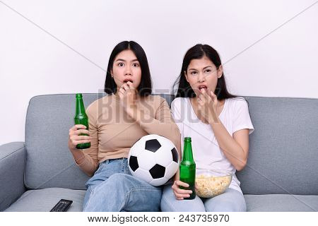 Concept Of Cheering. Asian Teenagers Watching Football On Television. People Are Cheering And Winnin