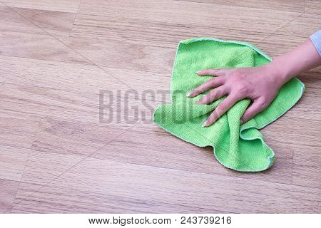 A Picture Of Women Hands Cleaning The Floor.