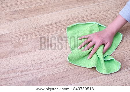 A Picture Of Women Hands Cleaning The Floor.