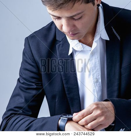 Time To Make Money! Businessman Checking Time On His Wrist Watch (work, Responsibility, Success, Tim