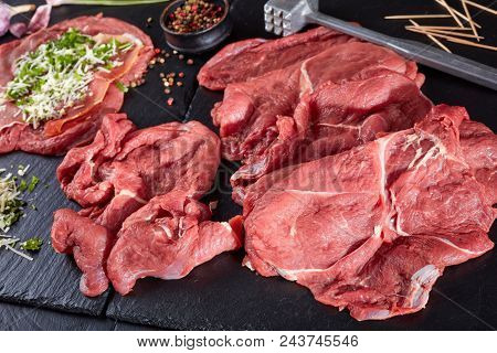 Raw Braciole - Prosciutto, Grated Parmesan Cheese And Finely Chopped Parsley Layered On Pounded Beef