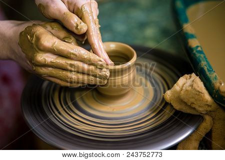 Close-up Hands Of Potter In Apron Making Vase From Clay, Selective Focus. Making It Together. Top Vi