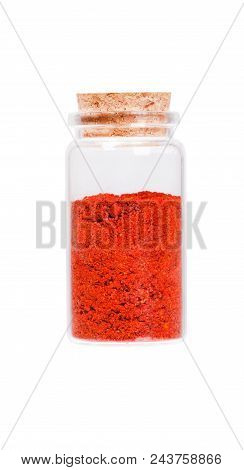 Powdered Pimienta Roja Red Pepper In A Glass Bottle With Cork Stopper, Isolated On White.