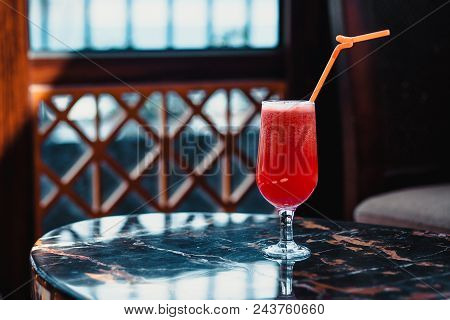 Red Cocktail With A Orange Straw. Fresh Watermelon Cocktail On The Restaurant Table. Juice, Alcohol,