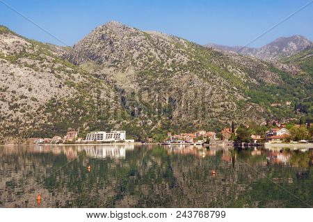 Coastal Mountains Are Reflected In Water.  Montenegro, Bay Of Kotor ( Adriatic Sea ), Risan Town