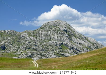rocky peak and white clouds of Montenegro Mountains
