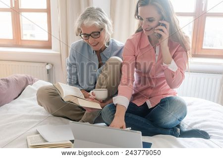 Mother and daughter leading the family business from home being busy