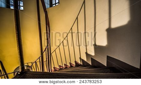 Upside View Of A Spiral Staircase And Shaddow