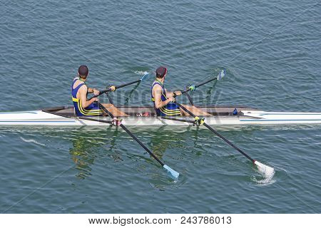 Two Young Rowers In A Racing Rower Boat