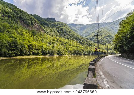 Highway Going Along The Olt River In Romania