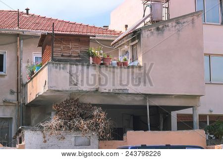 Detail Of An Abandoned Building In Cloudy Sky Landscape
