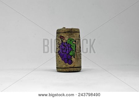 An Isolatd Cork With Little Painting Of Grape On It
