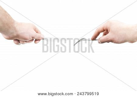 Male Hands Of The Left-hand Man Hold A Metal Fork And Knife, Isolated On A White Background, A First