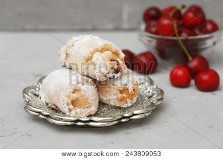 Homemade Biscuit Cookies Rolled With Cherry Jam On Gray Background.