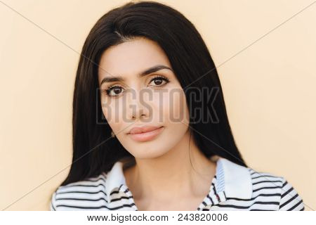 Close Up Portrait Of Brunette Young Female With Healthy Clean Skin, Perfect Make Up, Demonstrates He