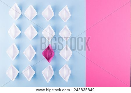 One Unique Pink Paper Boat Among Many Ones. Different Paper Ships As Think Different And Creativity 