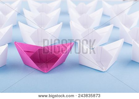 One Unique Pink Paper Boat Among Many Ones. Different Paper Ships As Individuality And Leadership Co