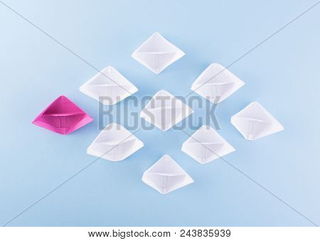 One Unique Pink Paper Boat Among Many Ones. Different Paper Ships As Individuality And Leadership Co
