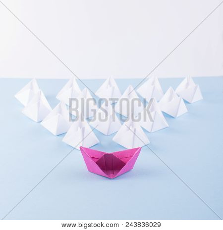 One Unique Pink Paper Boat Among Many Ones. Different Paper Ships As Individuality And Leadership Co