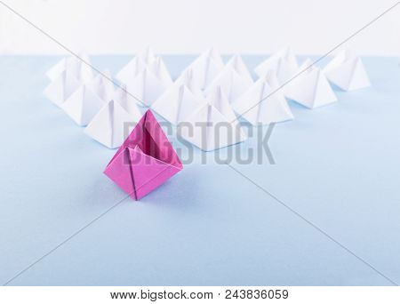 One Unique Pink Paper Boat Among Many Ones. Different Paper Ships As Individuality And Leadership Co