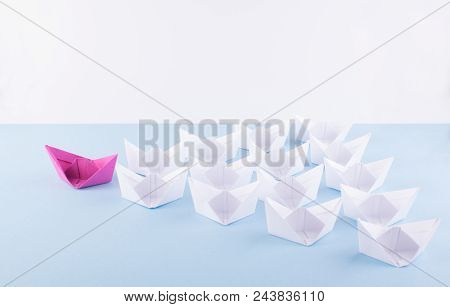 One Unique Pink Paper Boat Among Many Ones. Different Paper Ships As Individuality And Leadership Co