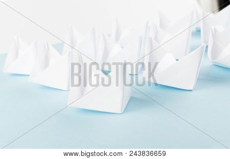 White Paper Boats Or Paper Ships Origami On Blue Background