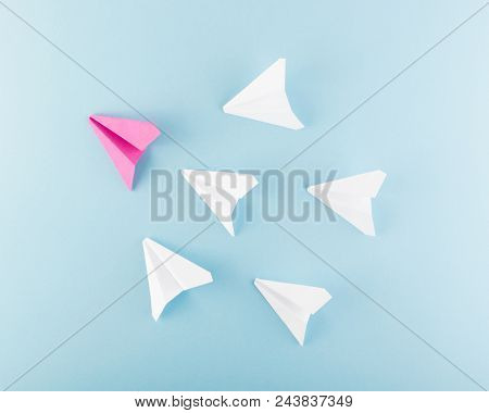 One Unique Pink Paper Plane Among Many Ones. Different Paper Airplanes As Individuality And Leadersh