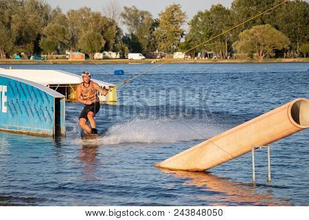 Pasohlavky, Czech Republic - June 03, 2017: Rider Wakeboarding In The Cable Wake Park Merkur In The 