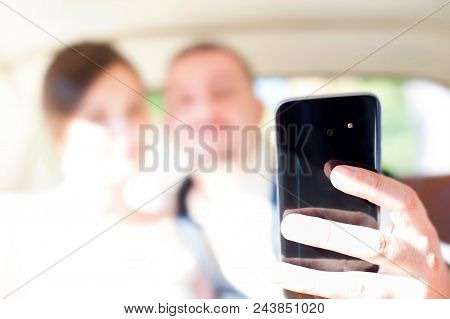 Just Married Happy Wedding Couple Sitting In The Car Together Doing Self Portrait With Modern Smartp