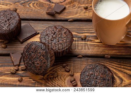 Chocolate Muffins On A Broun Rustic Wooden Table - Selective Focus. Brackfast