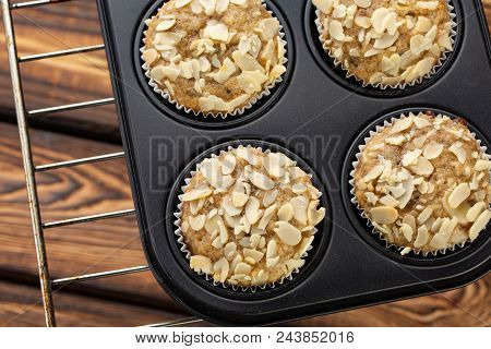 Homemade Blueberry Bran Muffins With Almond In Bakeware On Broun Wooden Background