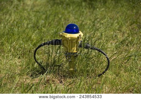 Pilot Light At Grass Field Near The Runway