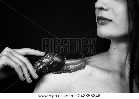 Black And White Portrait Of Female Face And Shoulder With A Big Snail Ahatin.