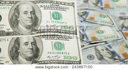 Old One Hundred Dollars Against The Background Of The New Ones.