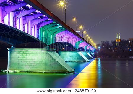 Christmas Lighting Of Slasko-dabrowski Bridge In Old Town With Reflection In The Vistula River At Ni
