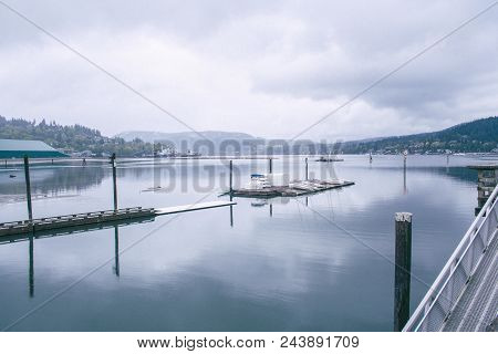 Misty Reflections On The Water In At Rock Point Spray Park In Port Moody, Bc, Vancouver