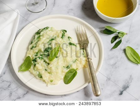 Gentle Cream Risotto With Spinach, Served With Wine. Light Background, Selective Focus.