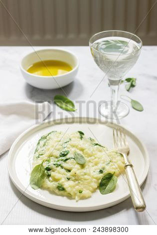 Gentle Cream Risotto With Spinach, Served With Wine. Light Background, Selective Focus.