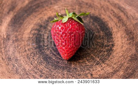 A Ripe Juicy Red Strawberry On A Plate