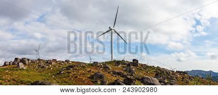 Wind turbine generators on top a hill for the production of clean and renewable energy near Fafe, Portugal