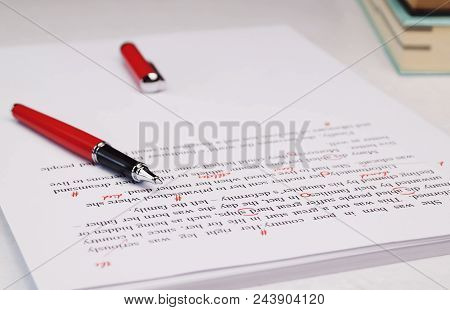 Proofreading Paper On White Table In Office