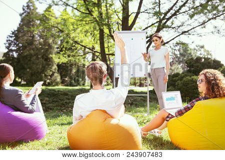 My Presentation. Inspired Slim Girl Standing At The Board And Discussing Her Project With Her Groupm