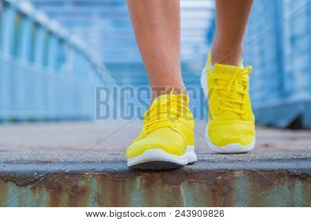 Close-up Of Man's Running Shoes While Walking Towards The Camera.