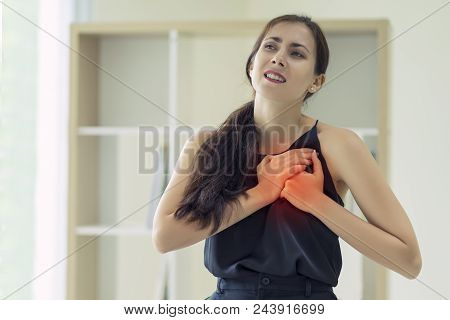 Woman Pressing On Chest With Painful Expression, Severe Heartache, Having Heart Attack Or Painful Cr